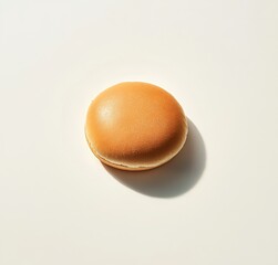 Single hamburger bun on white background.