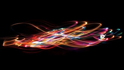 Abstract light painting swirls in vibrant colors on a black background.