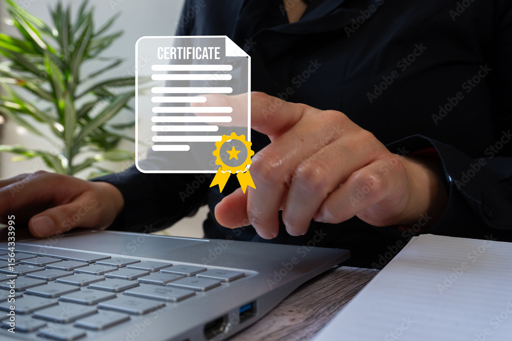 Fototapete Businesswoman in front of a computer pointing at an icon of a document with the word certificates and a recognition emblem