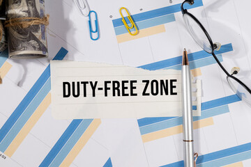 A Note with “Duty Free Zone” Set on the Desk with Graph and Charts – Tariff-Exempt Trade...