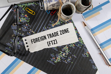 A Note with “Foreign Trade Zone” Set on the Desk with Graph and Charts – Customs & Tariff...