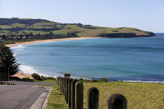 The famously scenic Werri surfing beach captured from the southern hill of Gerringong on a bright sunny blue sky day.
