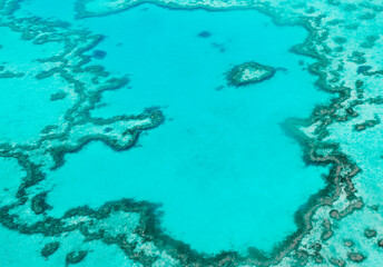 Aerial view of underwater reefs and Heart Reef of the Great Barrier Reef, the world's largest coral...