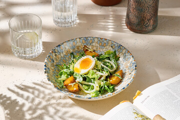 Warm squid and egg salad, bright natural lighting, overhead composition