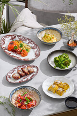 Garnish set, bright daylight, overhead composition, contemporary summer veranda, restaurant menu style