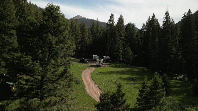 Low aerial of RVs camped in Idaho Salmon National Forest in summer