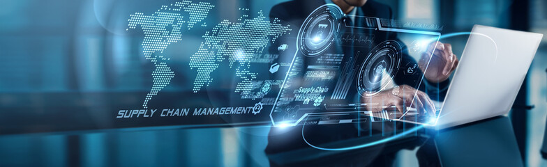 Businessman using laptop with analysis data of Supply Chain Management driving operational growth...