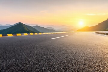 Empty asphalt highway stretching through a mountain range at sunset, featuring a clean sky and vibrant colors in the background