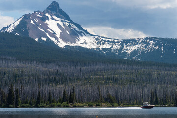Summer boating under Mt. Washington on Big Lake, Oregon