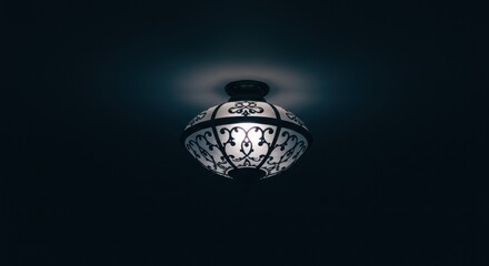 Elegant vintage ceiling lamp illuminating a dark room, creating a warm and inviting atmosphere