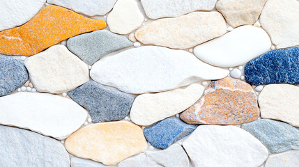 A close-up image of smooth, colorful river stones arranged in a decorative pattern, perfect for backgrounds or natural designs.