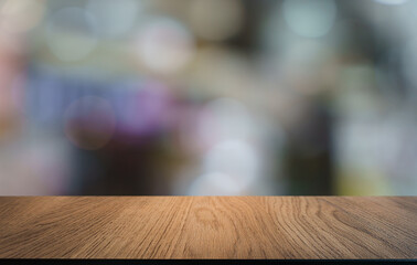 Empty wood table top and blur of restaurant background selective focus product display