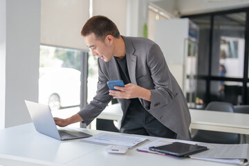 Business people holding Smartphone working mobile devices. cell telephone technology e-commerce...