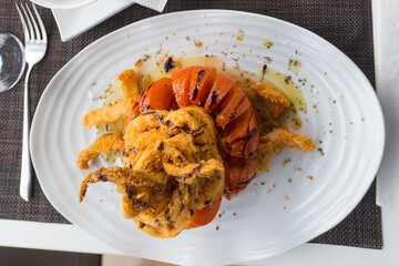 Crispy delicious fried squids served in a local restaurant in coastal village on Tenerife, Canary Islands, Spain