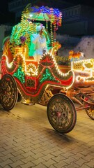 Fototapeta premium Decorative Colorful Horse Cart with Lights – Traditional Indian Festival
