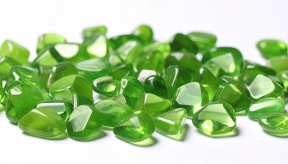 Vibrant Green Gemstones Scattered Against A Clean White Background Displaying Sparkling Facets