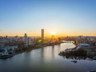 Yekaterinburg aerial panoramic view in spring at sunset. Yekaterinburg city and pond in spring or autumn.