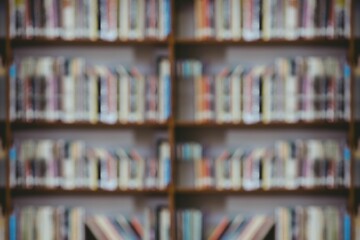 Blurred wooden bookshelf is being shown in flat design library, with rows of colorful book spines