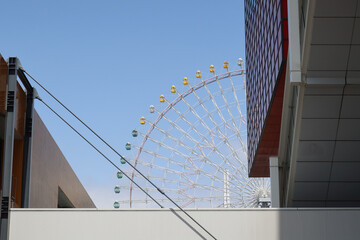 Osaka, Japan – April 15, 2024: The Tempozan Ferris Wheel, standing 112 meters tall under a blue...