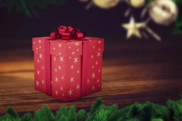 Fototapete 3D render is showing red snowflake ribboned gift box on wooden tabletop with pine boughs © vectorfusionart