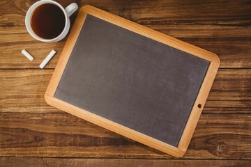 Composite image of chalkboard with coffee mug