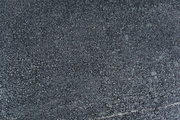 Gravel packed asphalt mixture is being shown in flat design illustration, highlighting loose stones
