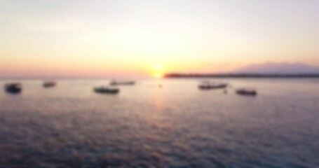 Defocused image of boats moored on sea