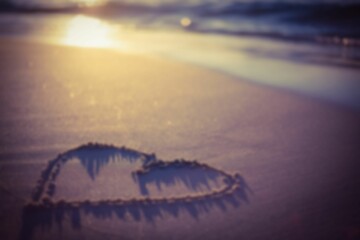 Heart shape on sand at beach