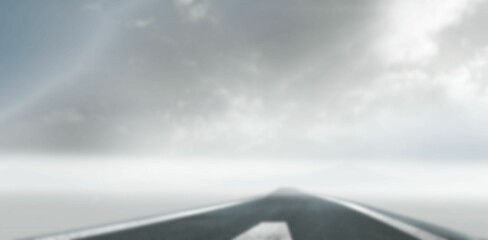 road leading against clouds