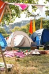 Bunting by tents on grassy field
