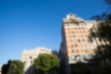 Buildings against clear blue sky