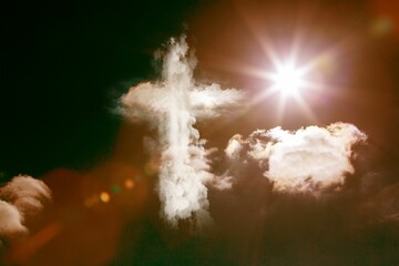 Cross-shaped cloud is shining in flat design sky, with sun lens flare small cumulus cloud