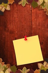 Autumn leaves with yellow note