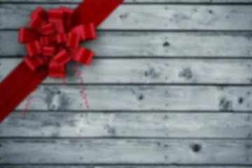 Fototapete Bright red curled ribbon and bow are being shown on weathered gray wooden planks, flat design © vectorfusionart
