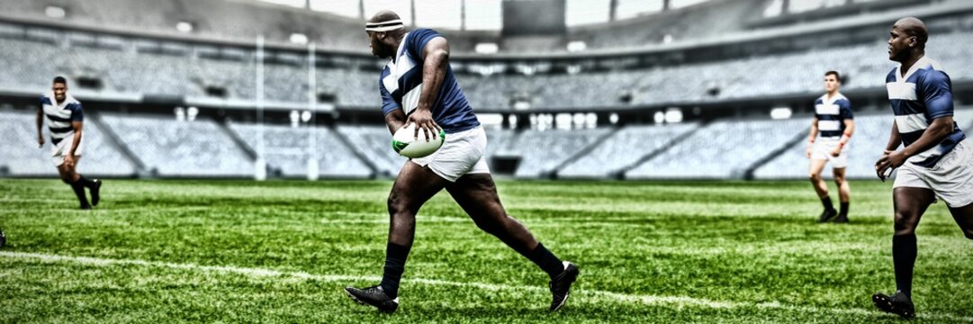 Rugby player throwing the ball to his teammate - Powered by Adobe