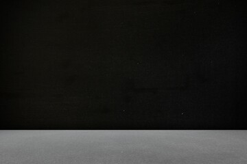 flat design studio scene is featuring smooth grey platform meeting textured black backdrop