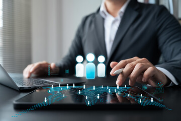 Digital transformation in human resource management. Businessman using smart technology and data...