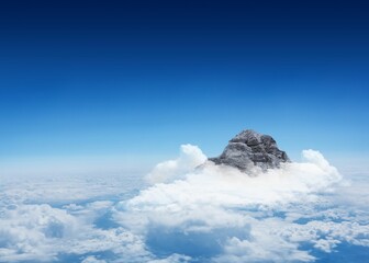 Mountain peak through the clouds