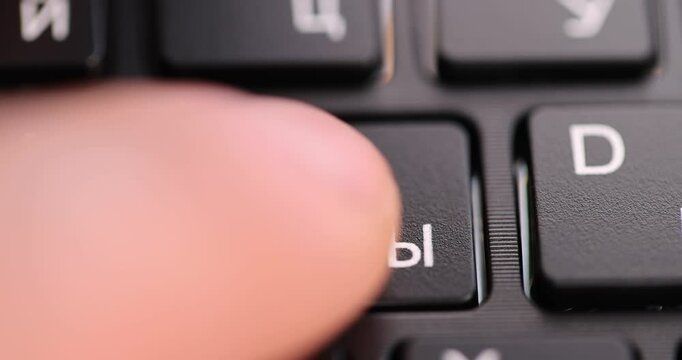 keyboard with English and Russian letters, the black keyboard in the layout of letters in several languages, close up