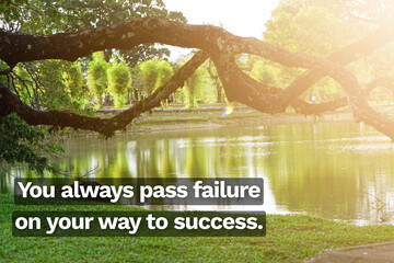 Inspirational life quote on blurry background. You always pass failure on your way to success.