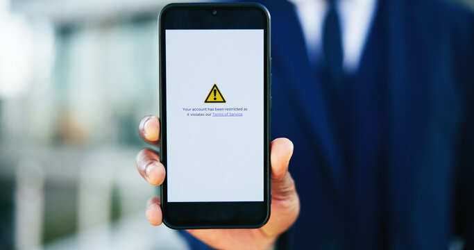 Business person, hands and phone screen with warning message for restricted access or notification. Closeup, accountant or user with mobile smartphone display or alert for app or account termination
