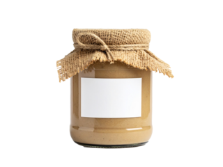 Glass jar with tahini, burlap lid, and blank label. Suitable for food blogs, packaging design, or culinary social media posts.