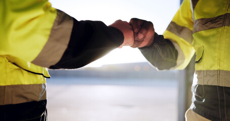 Fist bump, architect and construction people with support for partnership, teamwork and collaboration. Workers, agreement and greeting together on site for inspection, maintenance and logistics © FantiS/peopleimages.com
