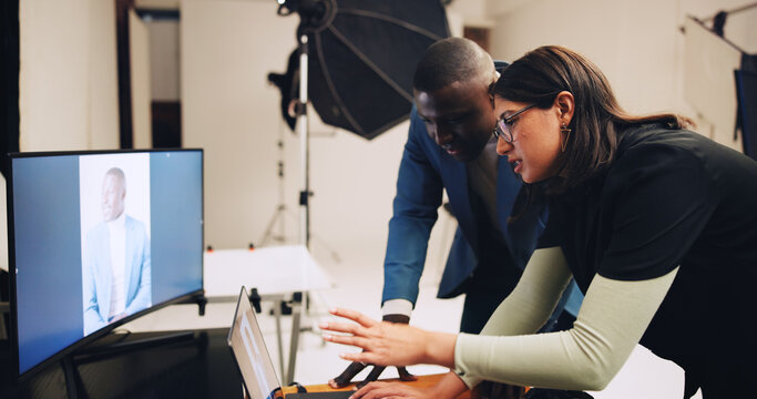 Computer, photographer and people in studio talking with results for editing, selection and process. Photography, creative and woman with male model on tech for post production, planning and design - Powered by Adobe