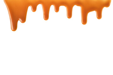 Melted caramel sauce drips down frame on transparent background