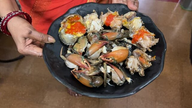Raw crab freshly cut and washed before cooking in Bengal, India 