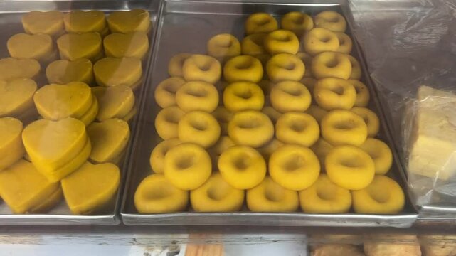Different types of Indian sweets like peda at display in one of the sweet meat shop in Kolkata, India