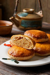 Close Up of Traditional Tau Sar Piah Chinese Pastry with Mung Bean Filling on Rustic Surface