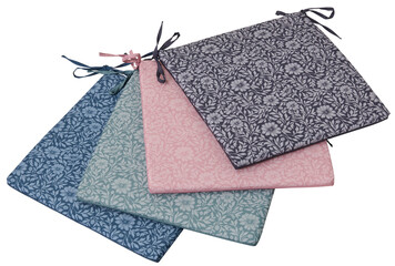Four floral patterned seat cushions in blue green pink and navy isolated on transparent background
