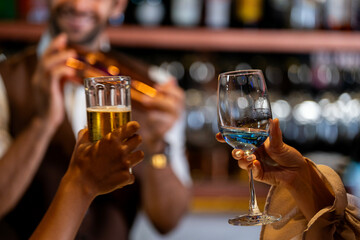 Two female friends enjoy a deep conversation over a glass of wine at a party or bar A concept for friendship social life and a girls night out